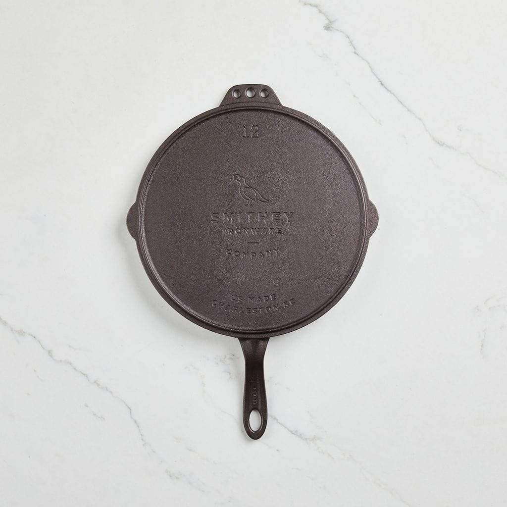 https://www.craftsmanmarket.com/cdn/shop/products/smithey-s-cast-iron-12-flat-top-cast-iron-griddle-28886329065659.jpg?v=1619116153